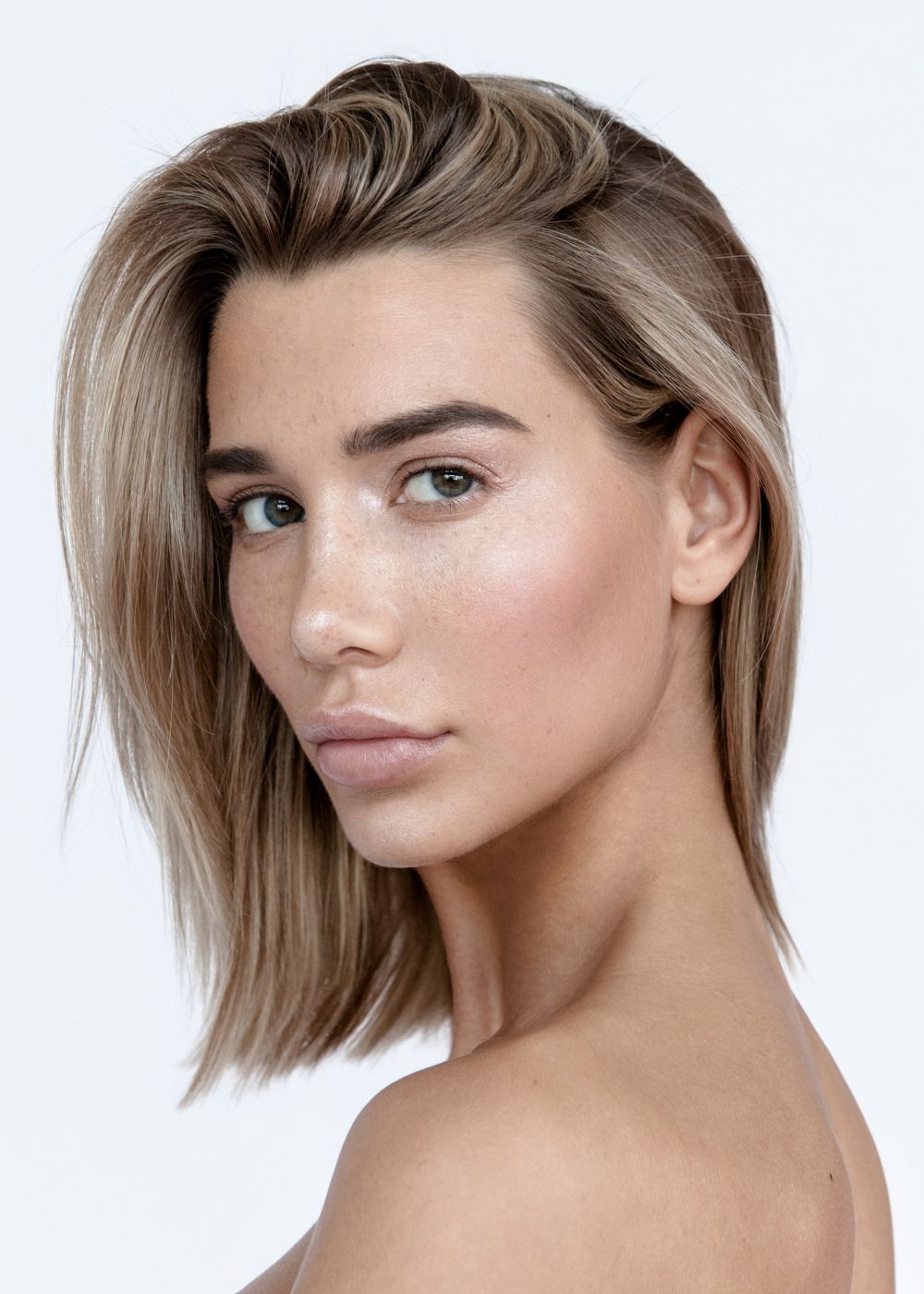 Portrait of a woman with shoulder-length hair.