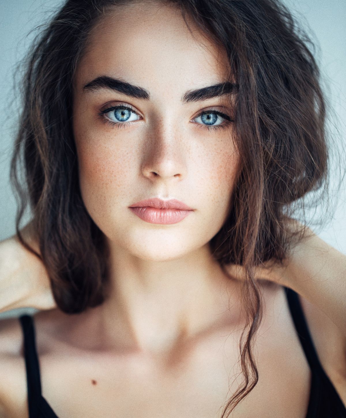 Close-up portrait of a woman with blue eyes.